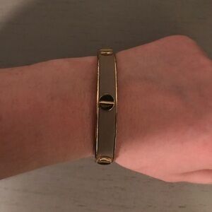 C. Wonder Beige leather and gold bangle